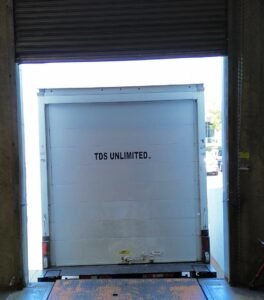 TDS Truck Backed to Warehouse